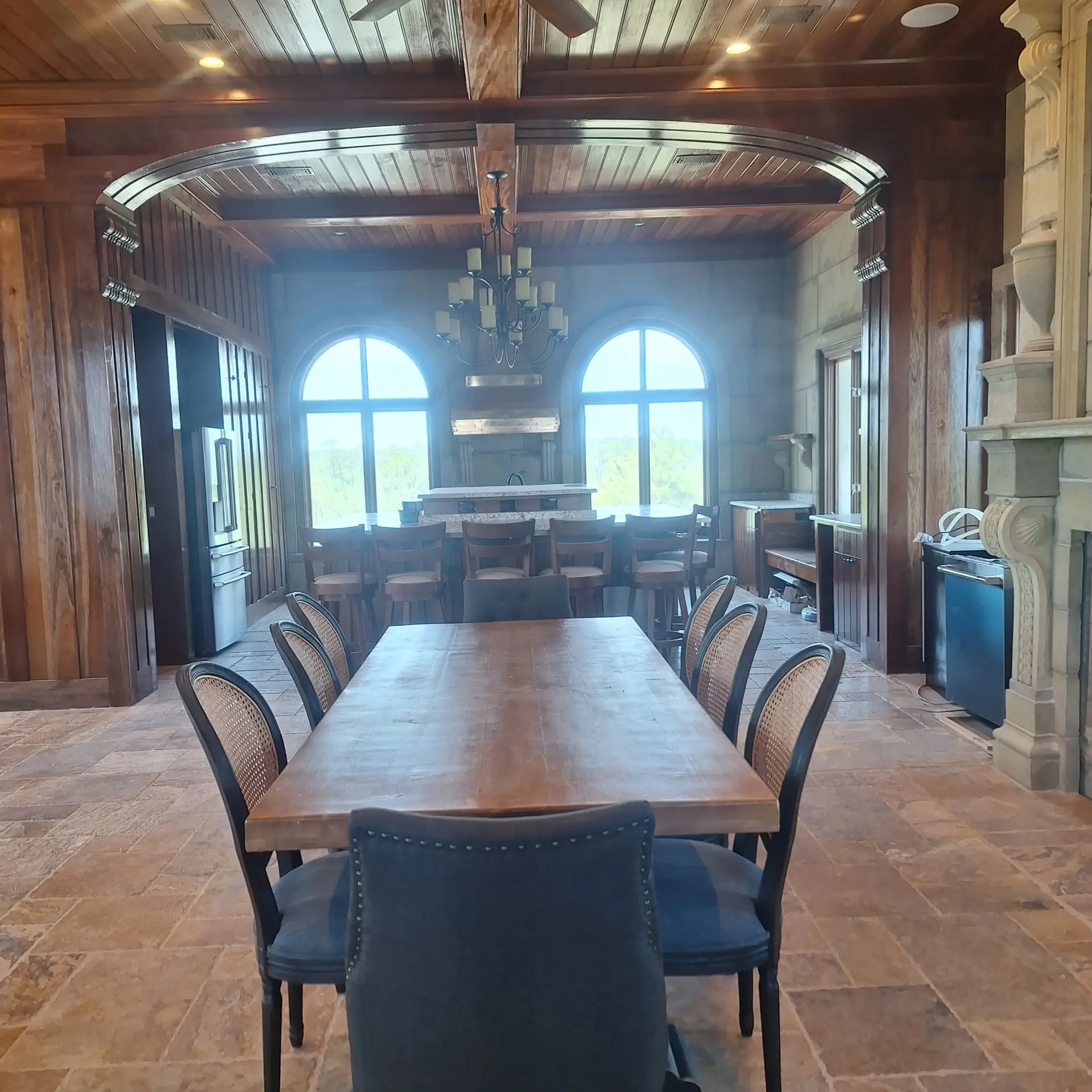 The best interior blending custom concrete exterior walls with dark custom woodwork